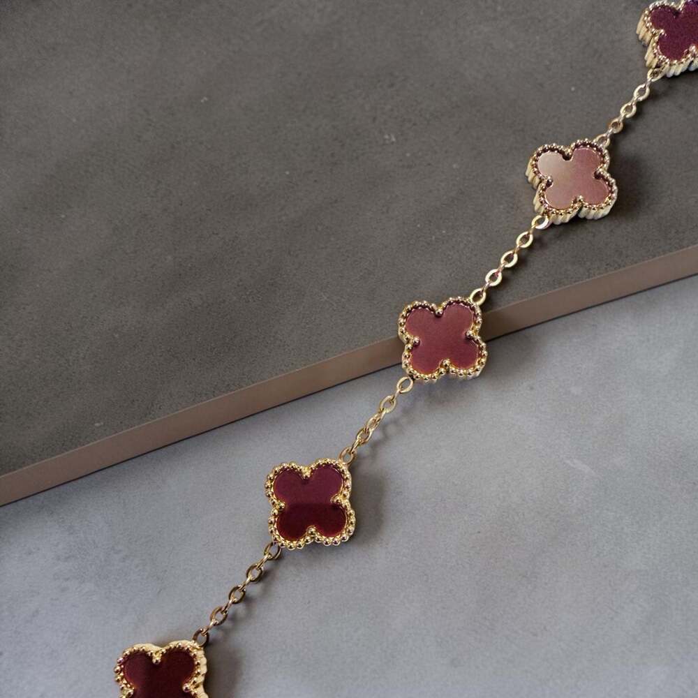 Clover Motif Charm Bracelet in Gold Tone with Burgundy Enamel